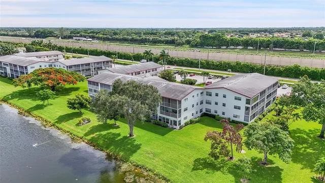 a view of a cars parked in front of a house