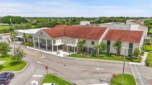 an aerial view of a house with a lake view