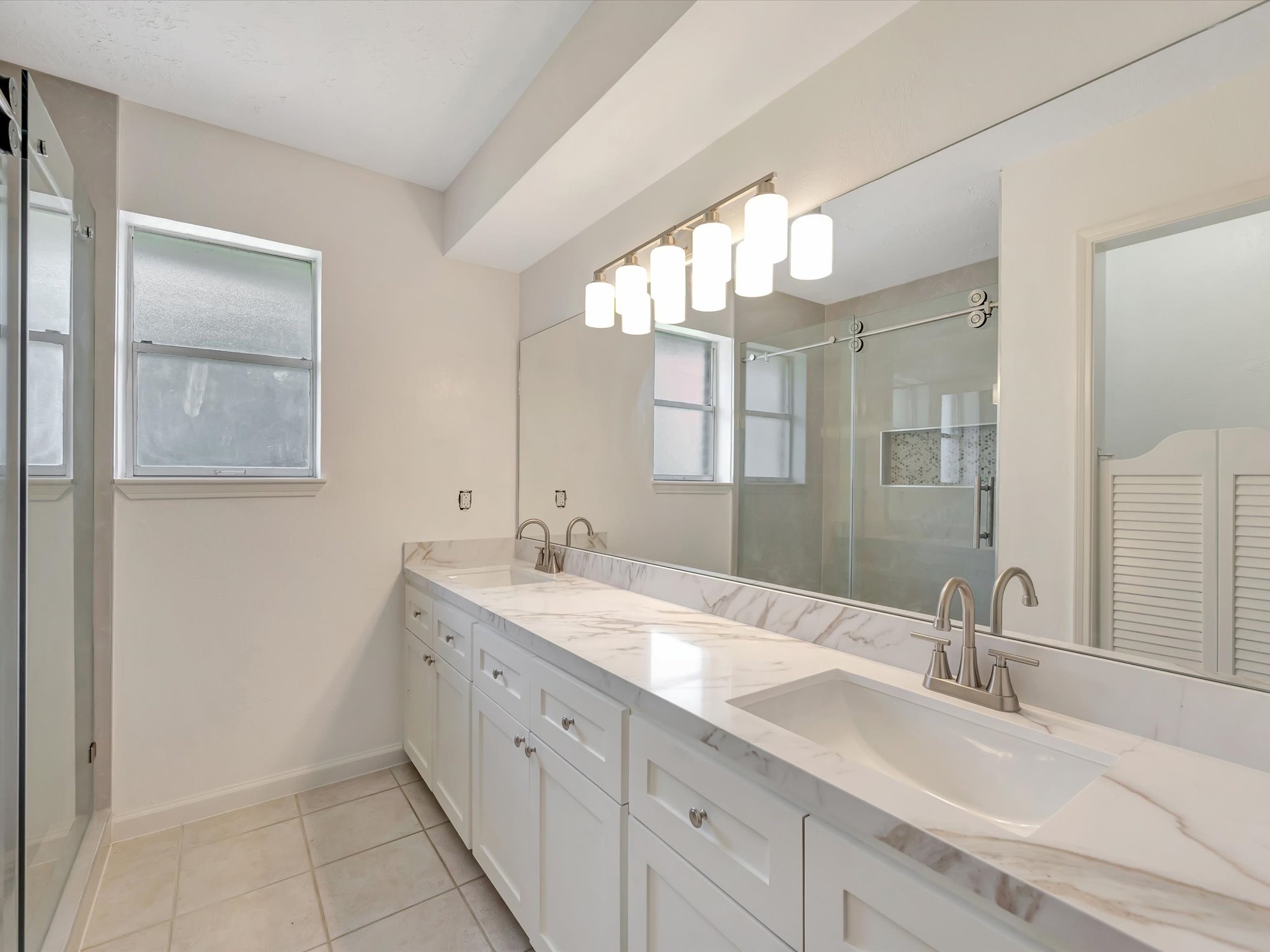 10340 Rocky Hollow Road La Porte, TX 77571 - Photo 25 of 38 Spa-inspired primary bathroom featuring double sinks and quartz countertops.