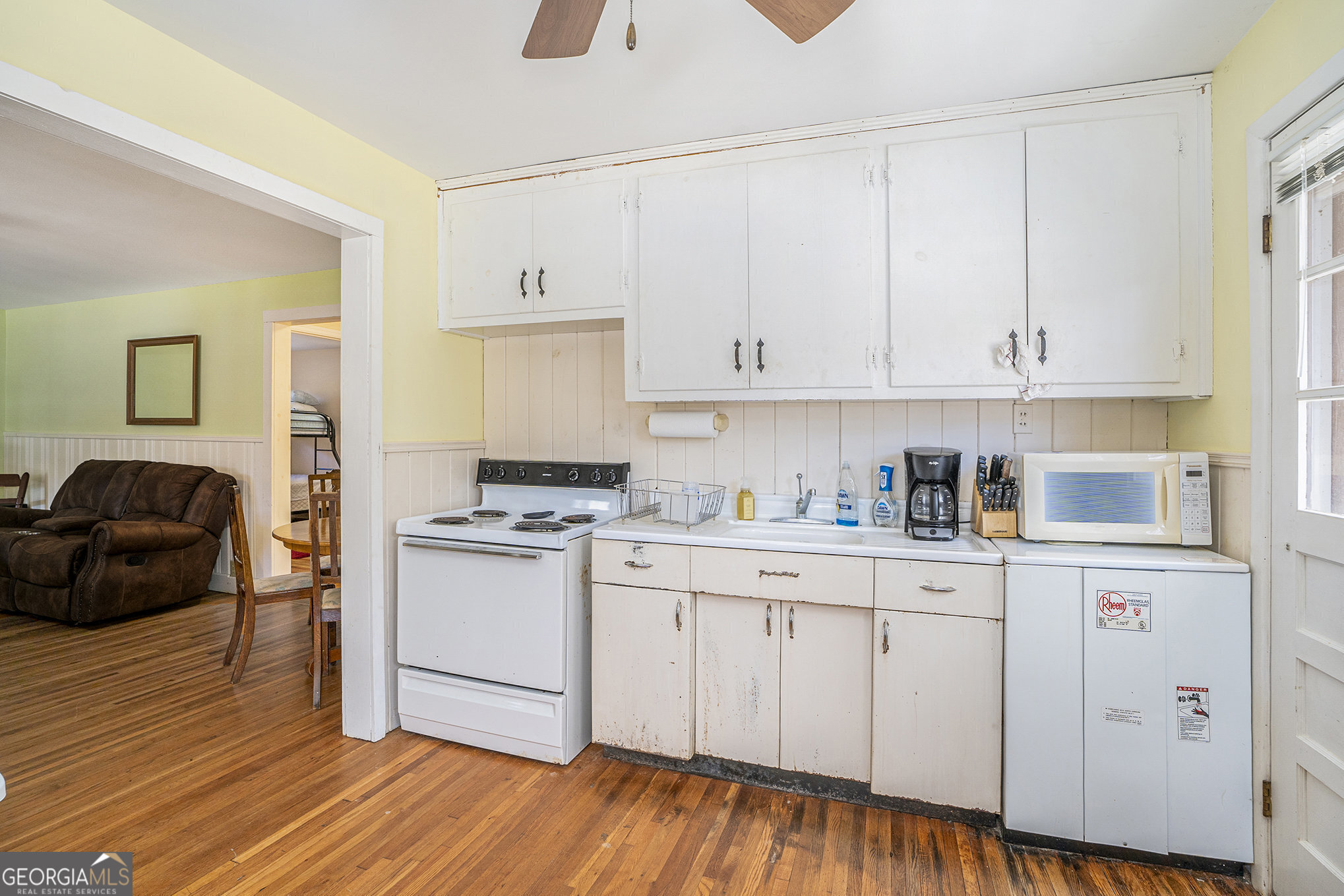 5622 Murray Cove Road Tiger, GA 30576 - Photo 12 of 39 a kitchen with stainless steel appliances granite countertop a stove a sink and white cabinets