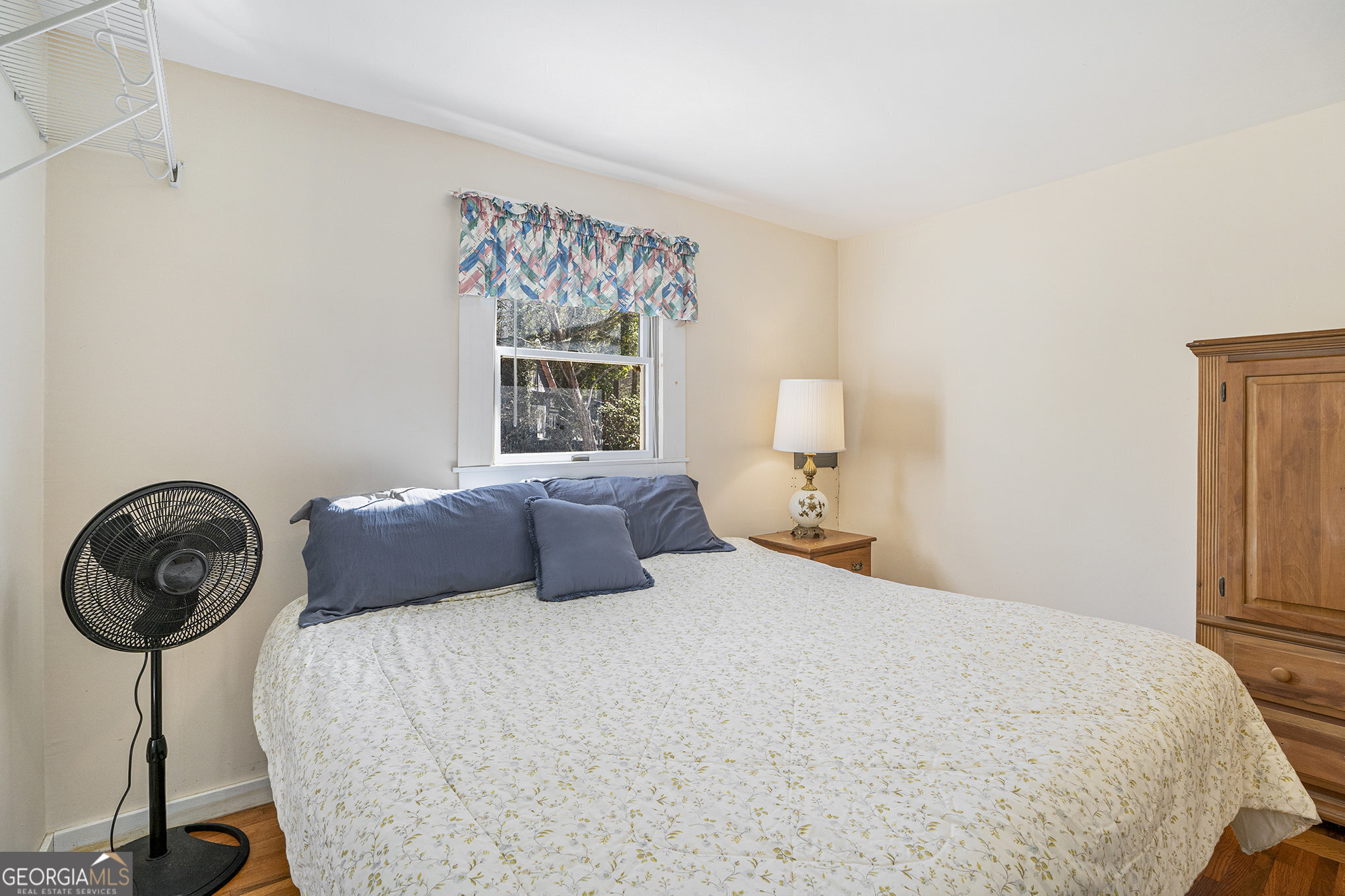 5622 Murray Cove Road Tiger, GA 30576 - Photo 15 of 39 a bedroom with a bed a table and chair