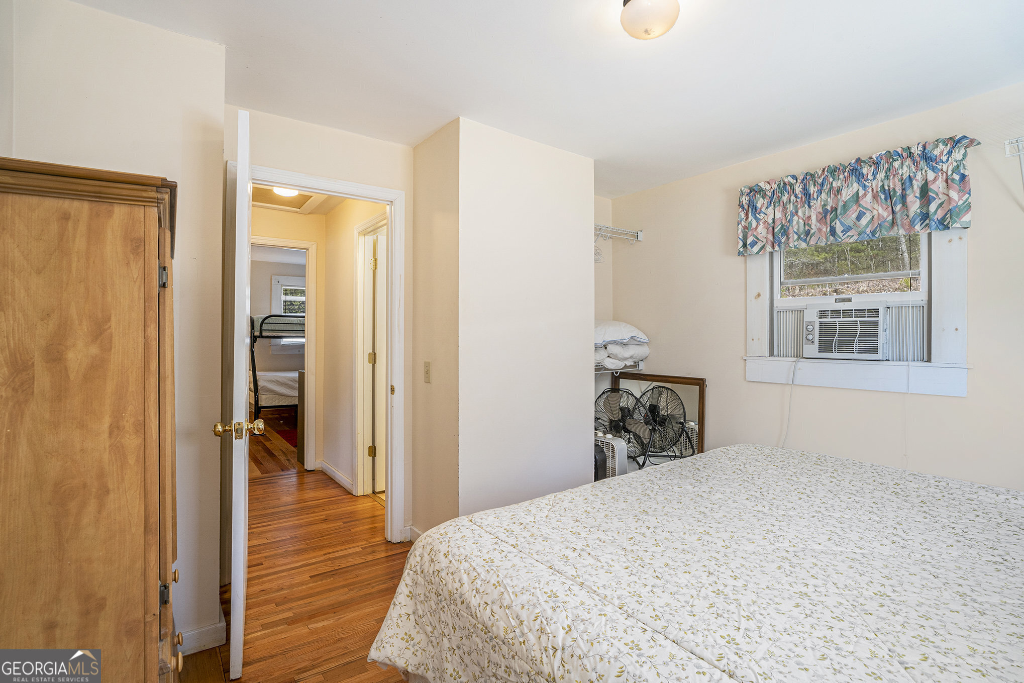 5622 Murray Cove Road Tiger, GA 30576 - Photo 16 of 39 a bedroom with a bed and a window