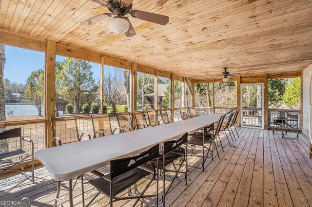 a view of a patio with wooden floor and outdoor seating