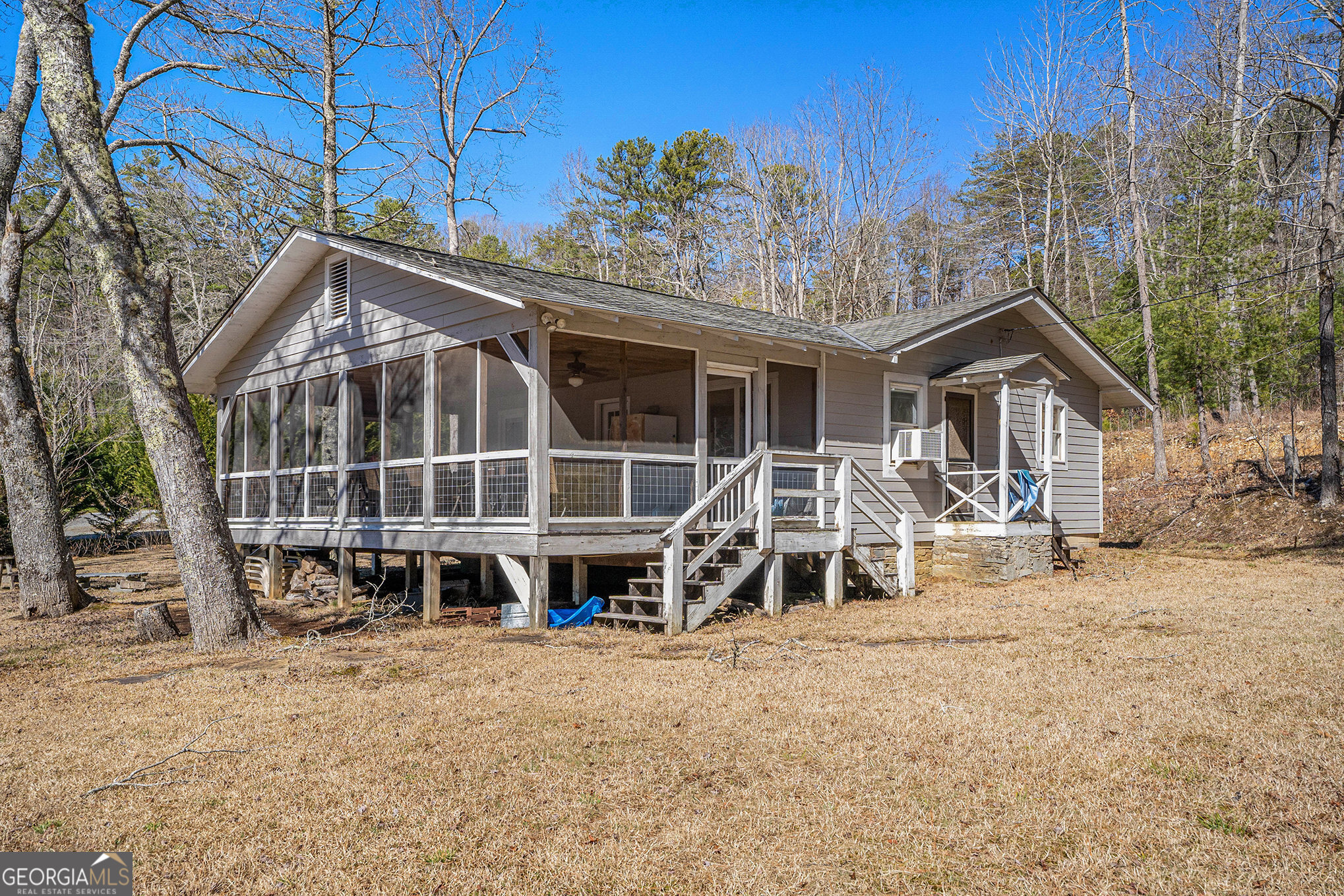 5622 Murray Cove Road Tiger, GA 30576 - Photo 24 of 39 a view of a house with a yard and sitting area