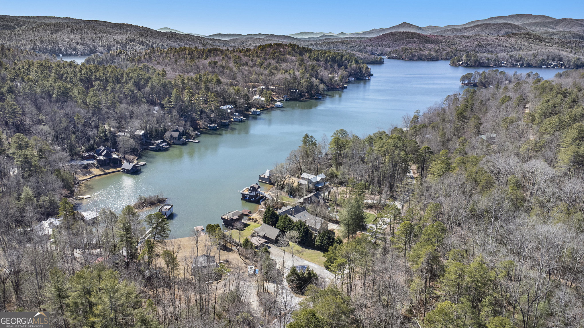 5622 Murray Cove Road Tiger, GA 30576 - Photo 38 of 39 a view of a lake with mountain in the background