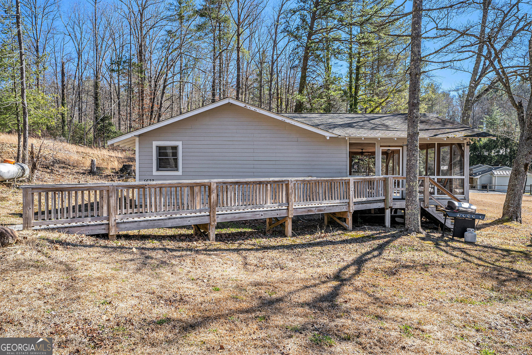 5622 Murray Cove Road Tiger, GA 30576 - Photo 4 of 39 a house with trees in front of it