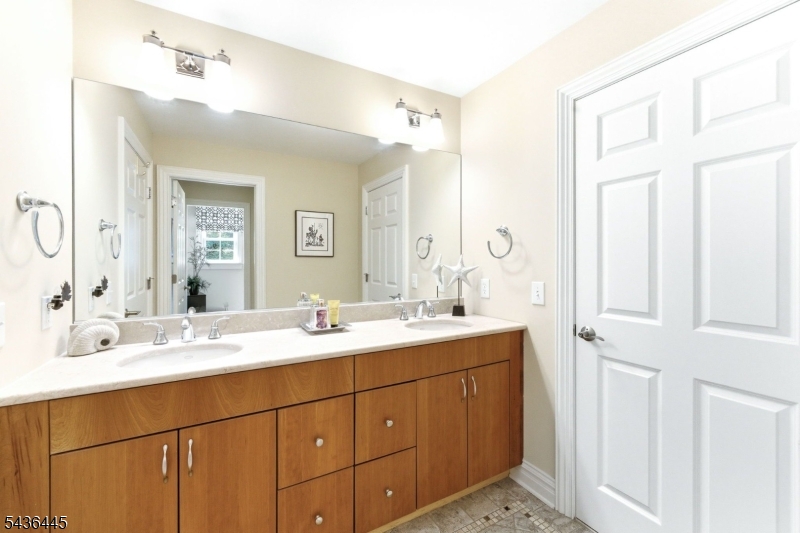 4 Windemere Way Sparta, NJ 07871 - Photo 31 of 50 a bathroom with a double vanity sink mirror and