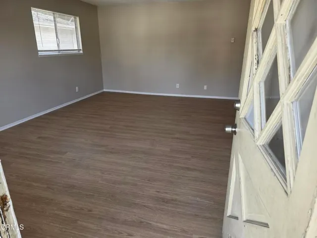 a view of an entryway with wooden floor