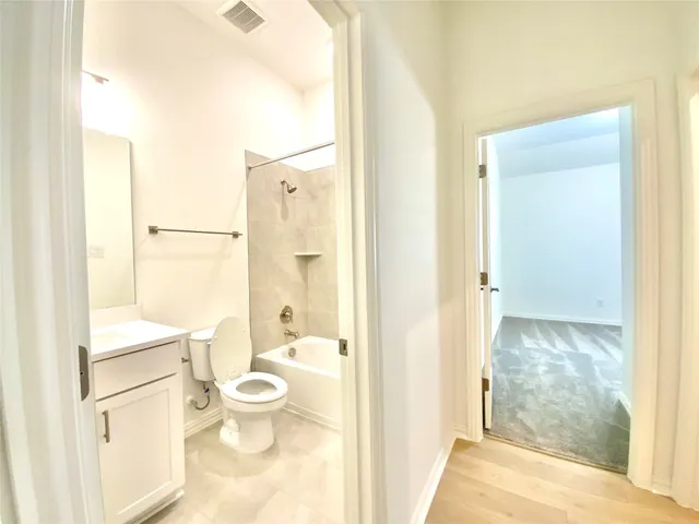 a kitchen with stainless steel appliances kitchen island granite countertop a stove microwave and refrigerator