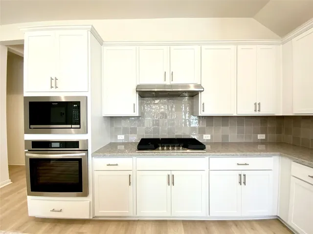 a bathroom with a sink shower and a bathtub