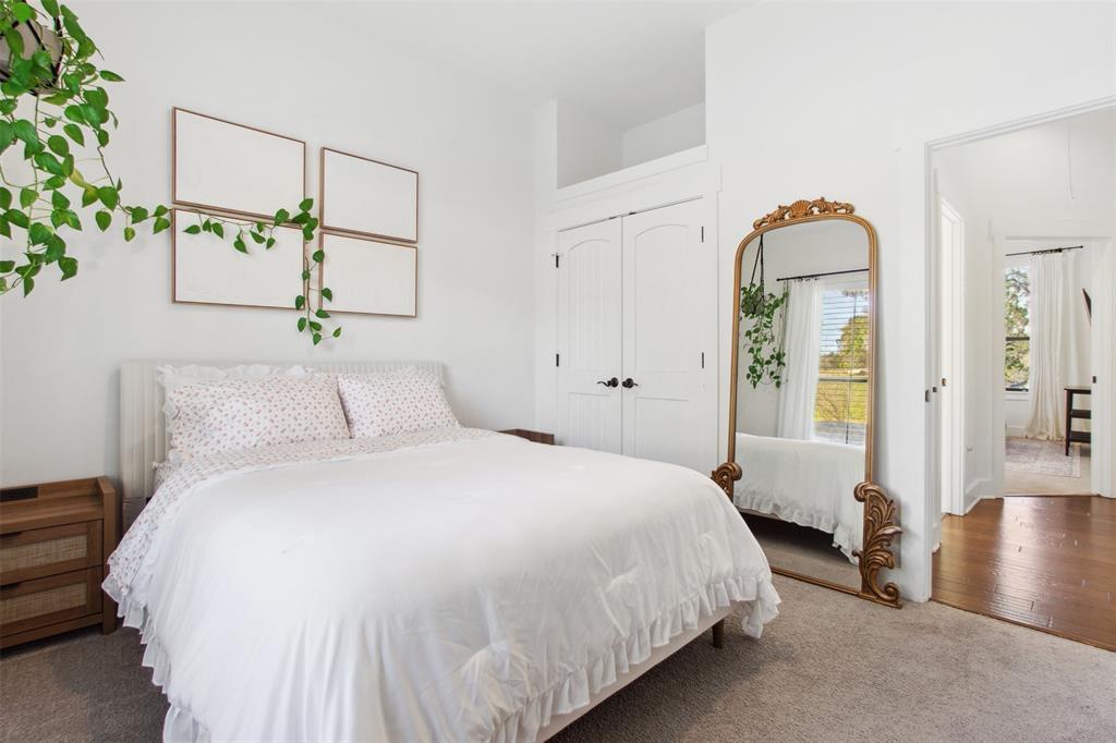 18852 Hidden Ridge Place Jonestown, TX 78645 - Photo 23 of 29 a bedroom with a bed and a chandelier