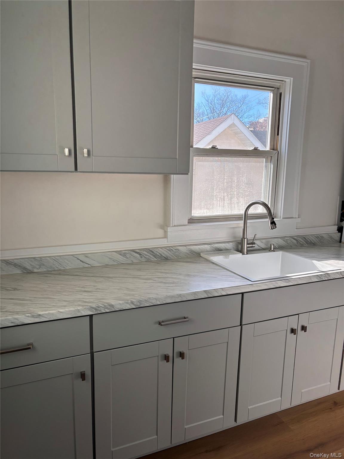 166 Lake Avenue, Unit 2 Tuckahoe, NY 10707 - Photo 10 of 14 Galley Kitchen w/new cabinetry and new laminate floor