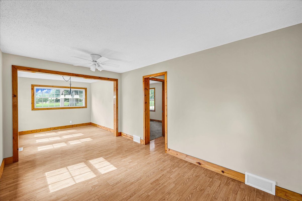 116 Lakeview Road East Galesburg, IL 61430 - Photo 13 of 36 a view of an empty room with window and wooden floor