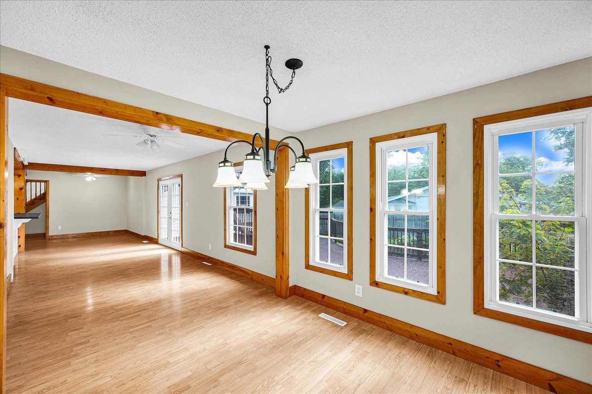 116 Lakeview Road East Galesburg, IL 61430 - Photo 14 of 36 a view of an empty room with a window and wooden floor