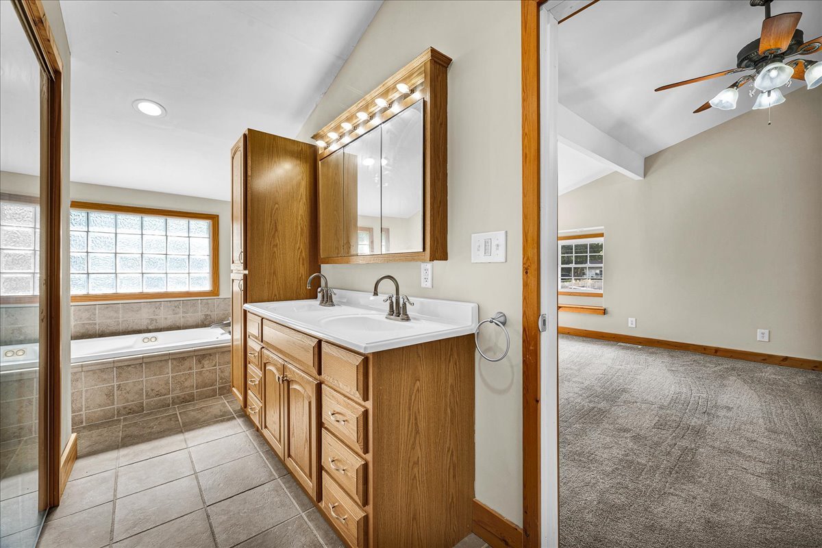 116 Lakeview Road East Galesburg, IL 61430 - Photo 17 of 36 a bathroom with a tub sink and mirror
