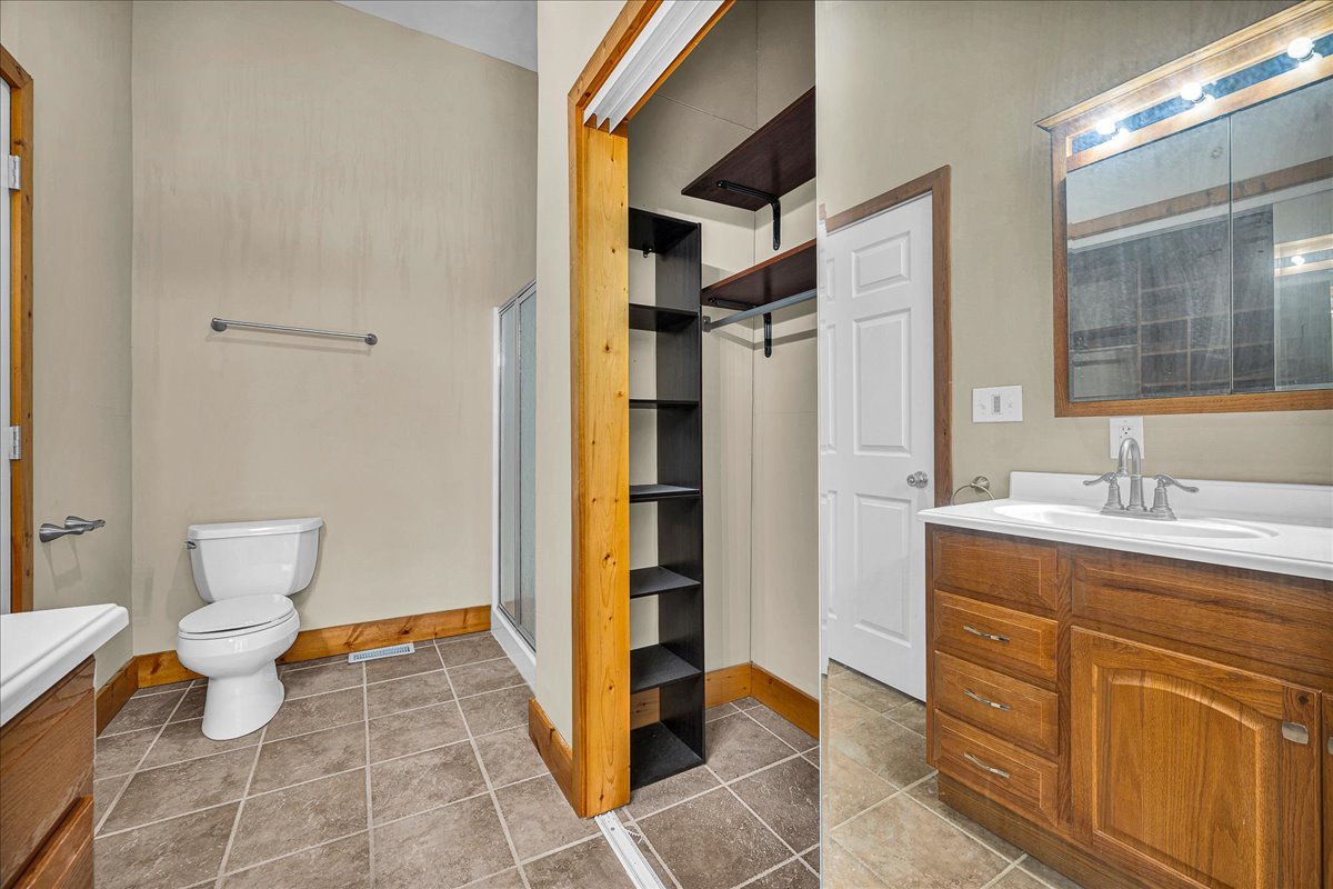 116 Lakeview Road East Galesburg, IL 61430 - Photo 18 of 36 a bathroom with a sink toilet and shower