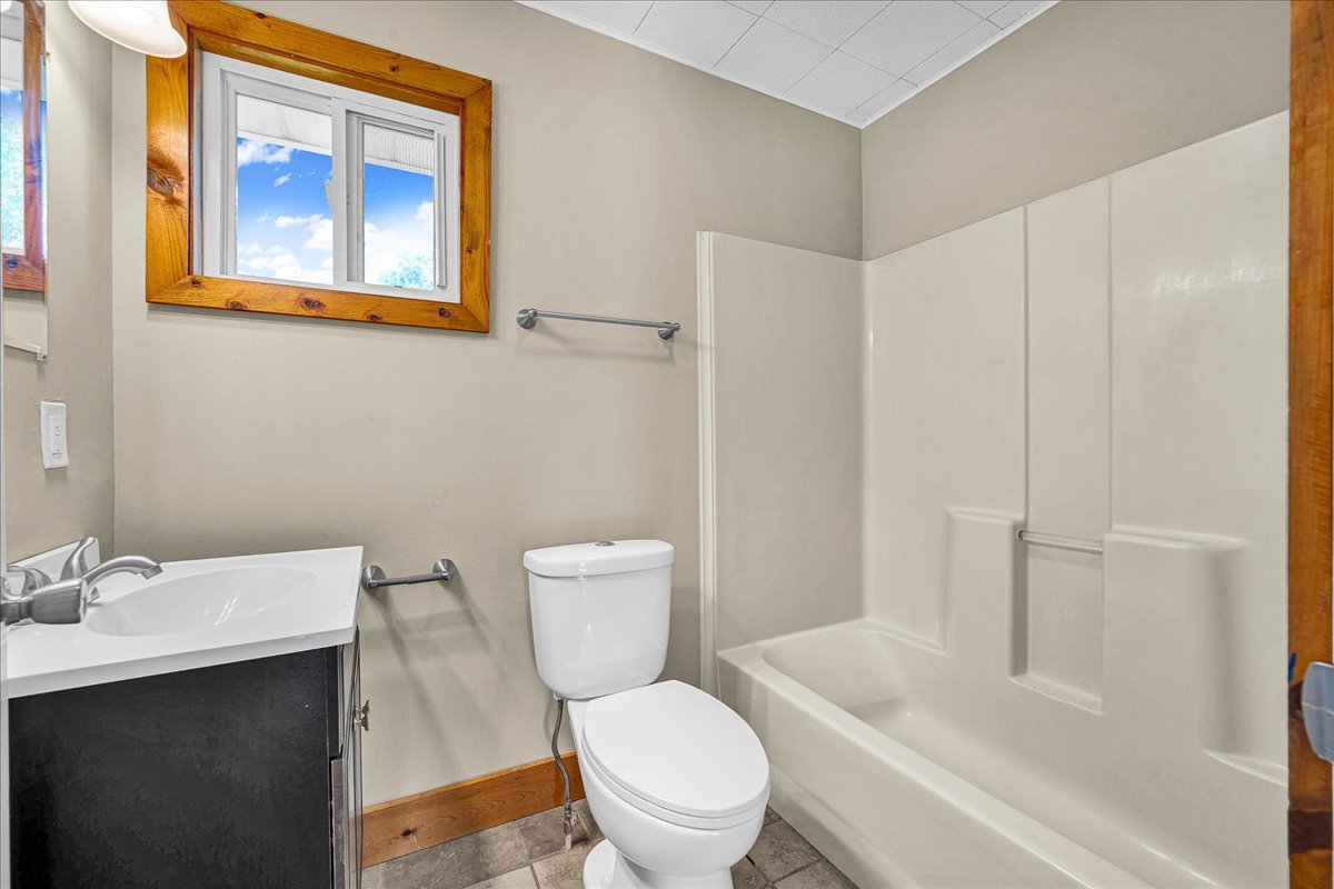 116 Lakeview Road East Galesburg, IL 61430 - Photo 20 of 36 a white toilet sitting next to a bathroom sink and tub