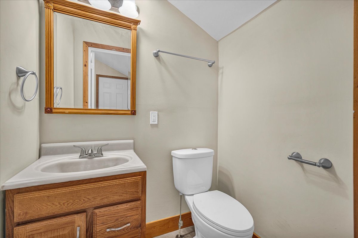 116 Lakeview Road East Galesburg, IL 61430 - Photo 22 of 36 a bathroom with a granite countertop toilet sink and mirror