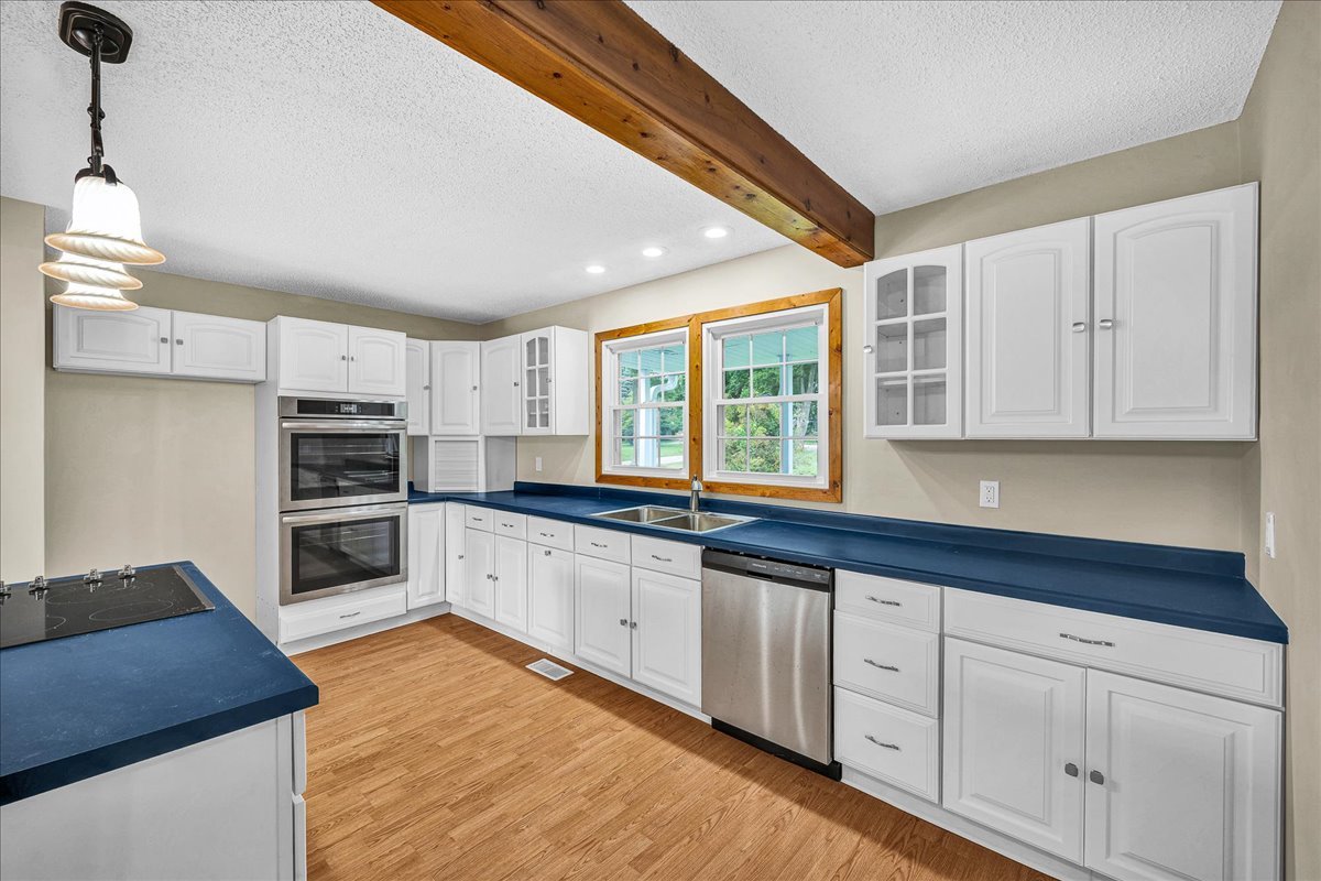 116 Lakeview Road East Galesburg, IL 61430 - Photo 8 of 36 a kitchen with granite countertop white cabinets and stainless steel appliances