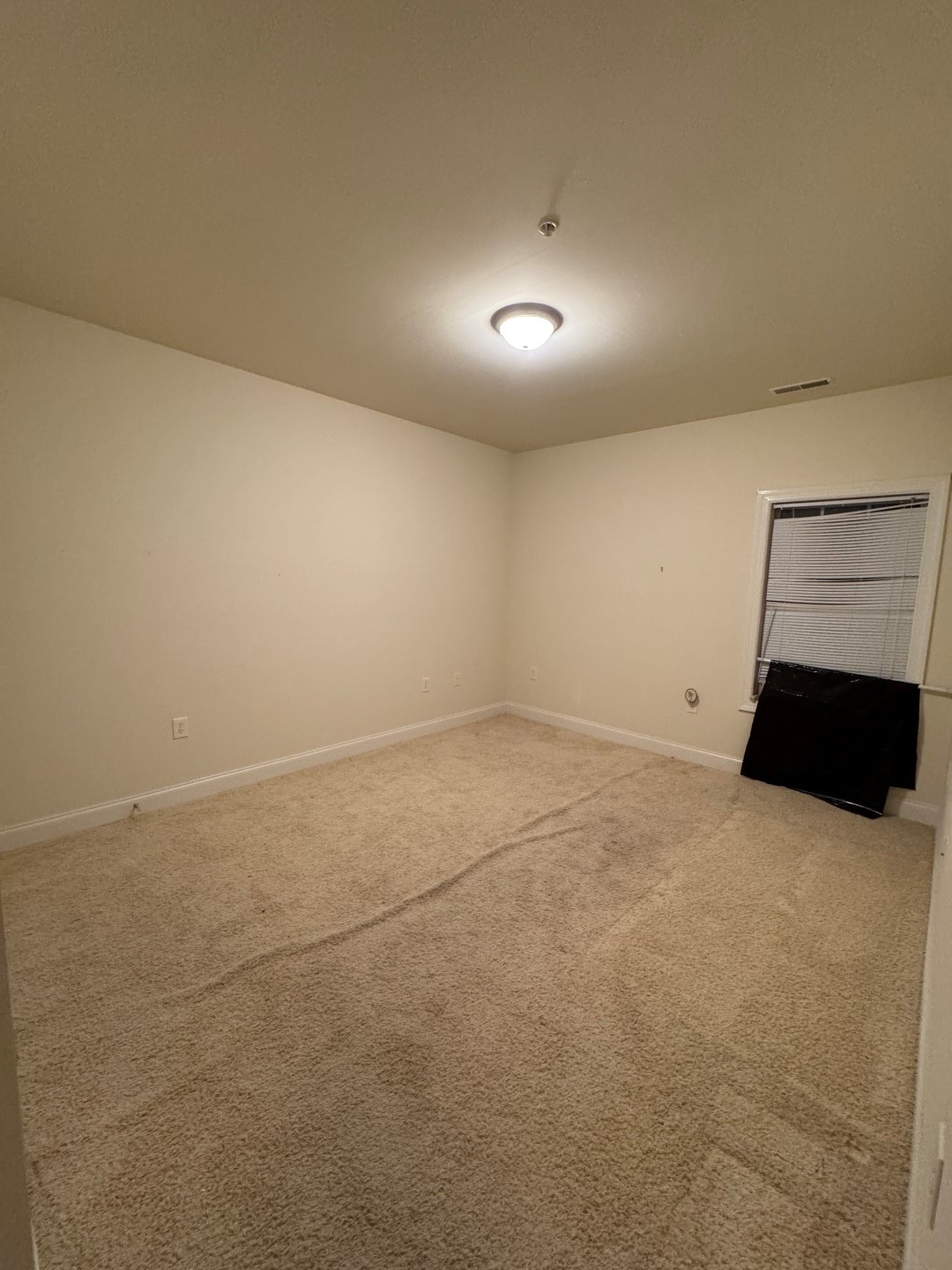 110 Westview Drive Spring Hill, TN 37174 - Photo 14 of 14 an empty room with wooden floor and windows
