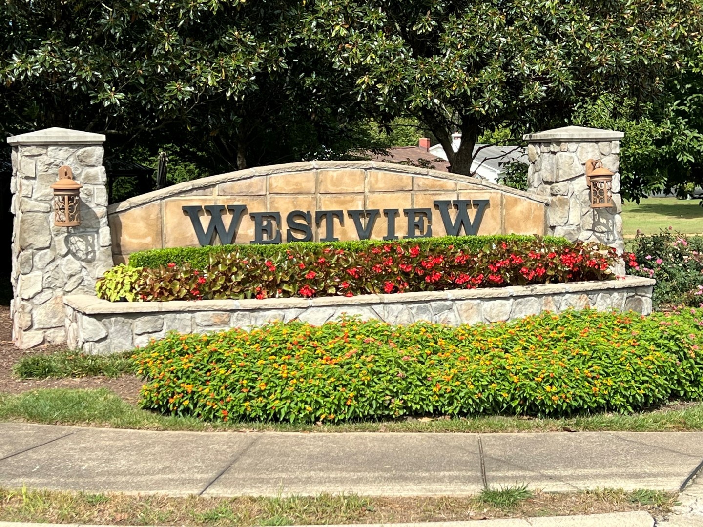 110 Westview Drive Spring Hill, TN 37174 - Photo 3 of 14 a view of a garden with flowers and trees