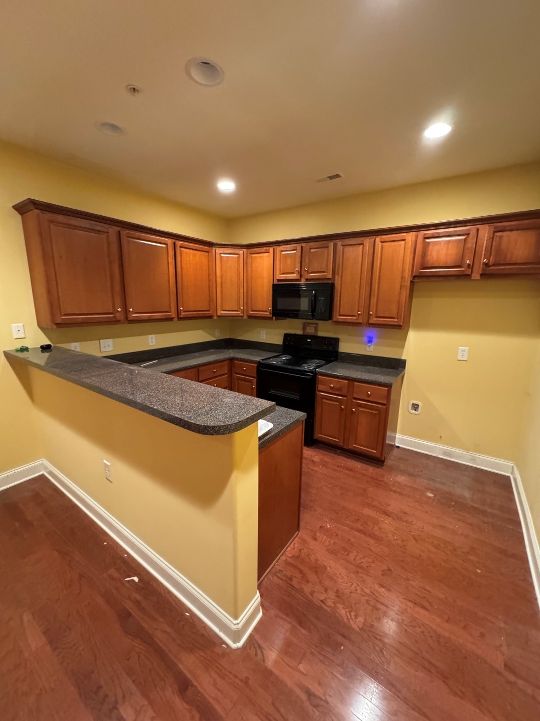 110 Westview Drive Spring Hill, TN 37174 - Photo 9 of 14 a kitchen with stainless steel appliances granite countertop a stove a sink and a microwave