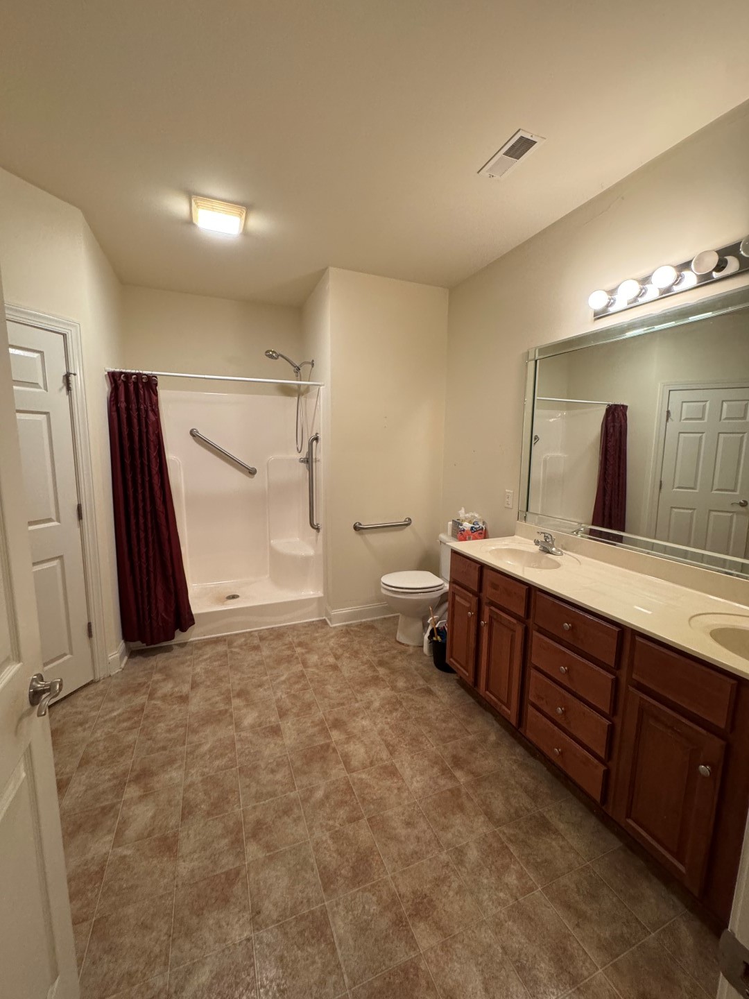 110 Westview Drive Spring Hill, TN 37174 - Photo 10 of 14 a bathroom with a double vanity sink and a mirror