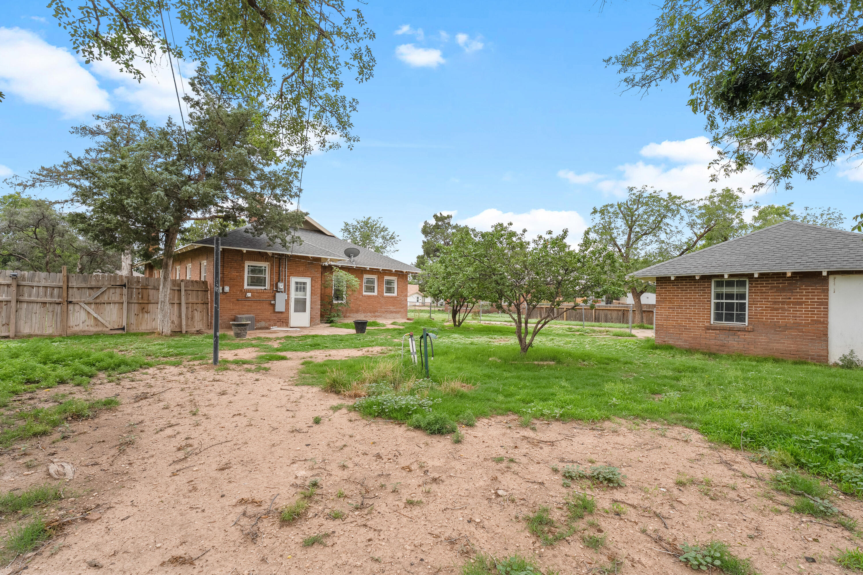 500 West Garza Street Slaton, TX 79364 - Photo 23 of 24 a view of a house with a yard