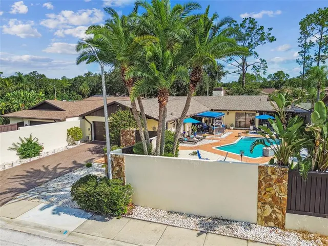 a view of a swimming pool with outdoor seating