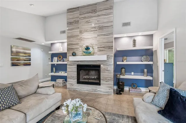 a living room with furniture and a fireplace