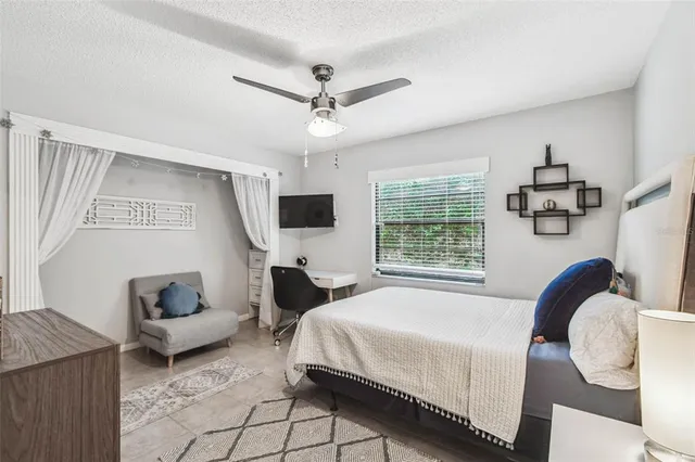 a bathroom with a granite countertop sink toilet a mirror and shower