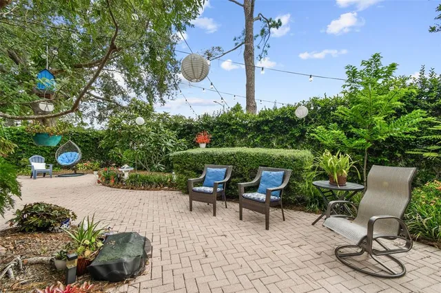 a view of a backyard with sitting area