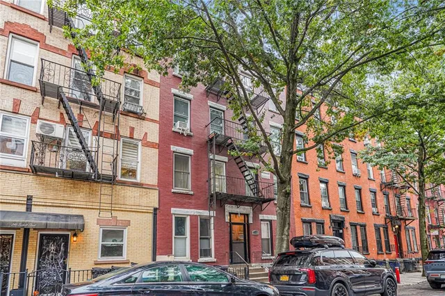 a city street lined with buildings and cars