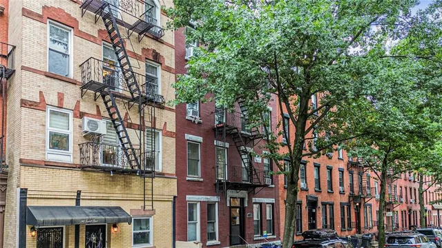 a view of a building with a tree