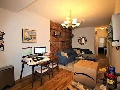 a work room with furniture and a chandelier