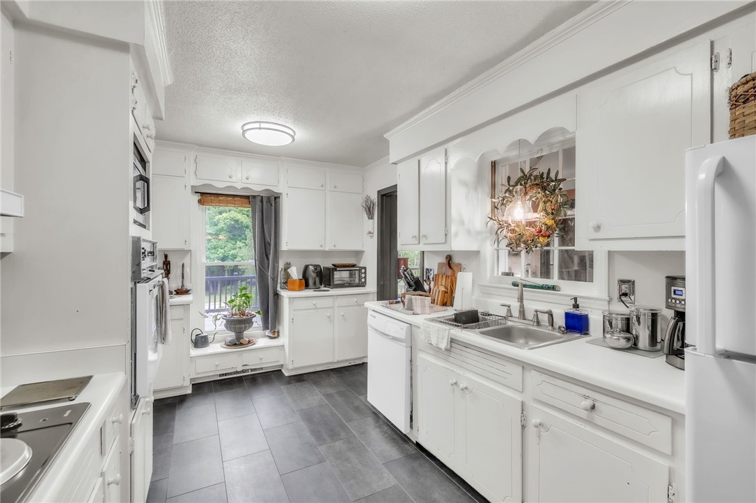 722 Lay Bridge Road Central, SC 29630 - Photo 14 of 32 This spacious kitchen offers a functional layout with ample cabinet and counter space.