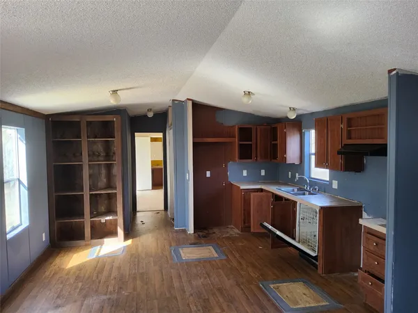 a kitchen with stainless steel appliances granite countertop a stove and a refrigerator