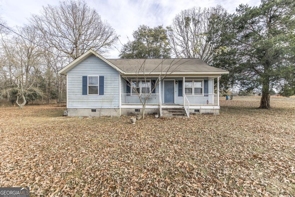 246 Terrell Road Elko, GA 31025 - Photo 1 of 1 a house with trees in the background
