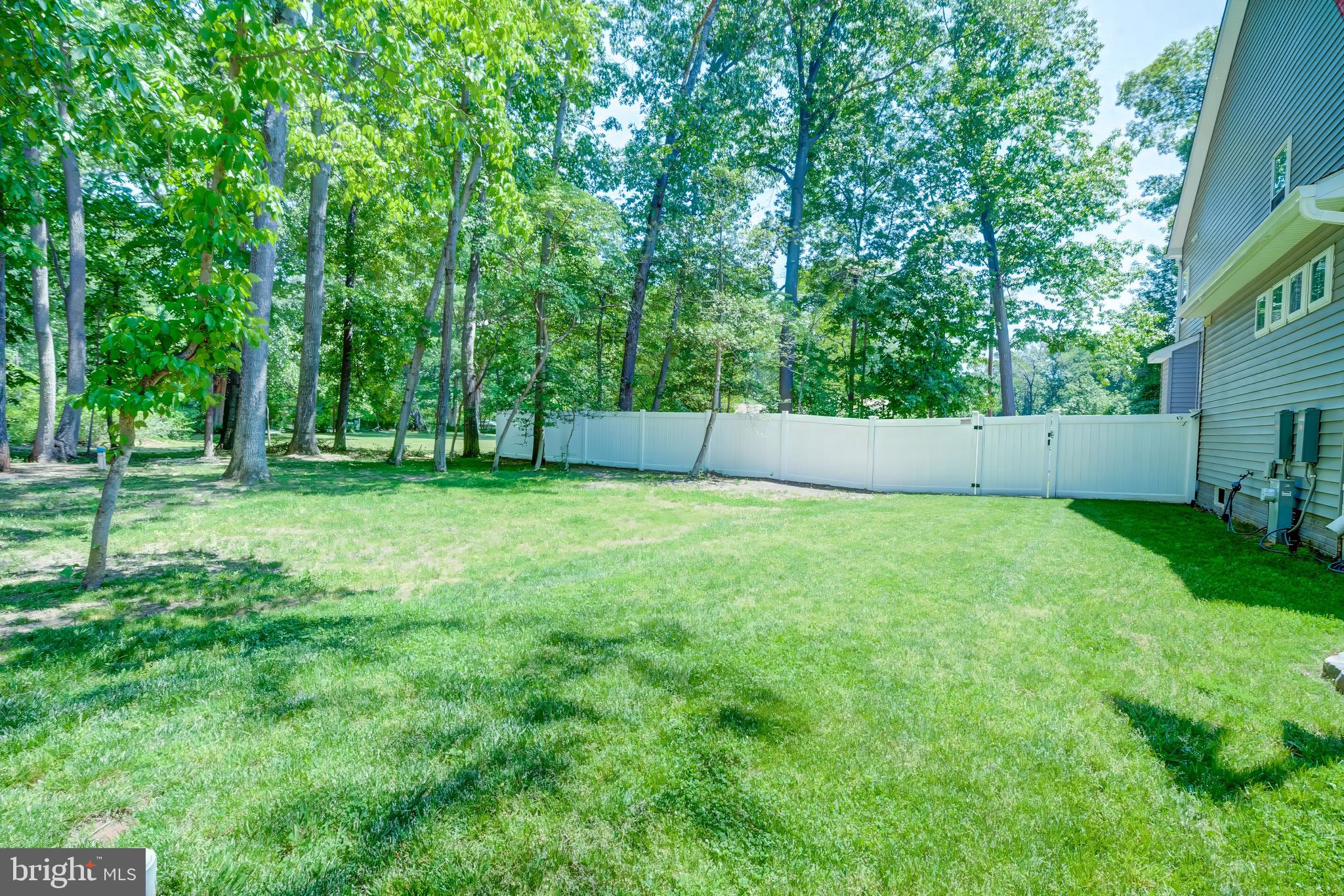 8331 Woodland Road Pasadena, MD 21122 - Photo 51 of 63 Yard Fenced with White Vinyl Fencing