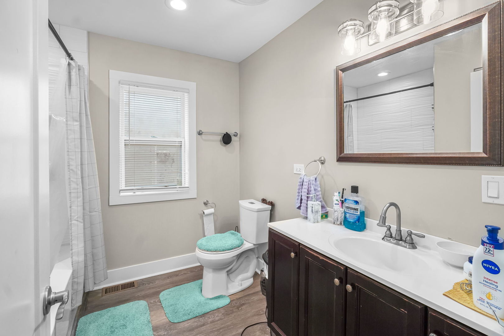1906 South 60th Court Cicero, IL 60804 - Photo 12 of 40 a bathroom with a toilet sink and mirror