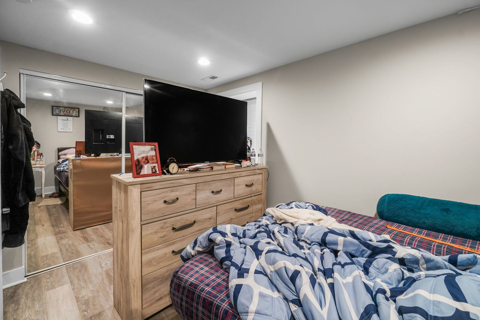 1906 South 60th Court Cicero, IL 60804 - Photo 25 of 40 a bedroom with a bed and flat screen tv