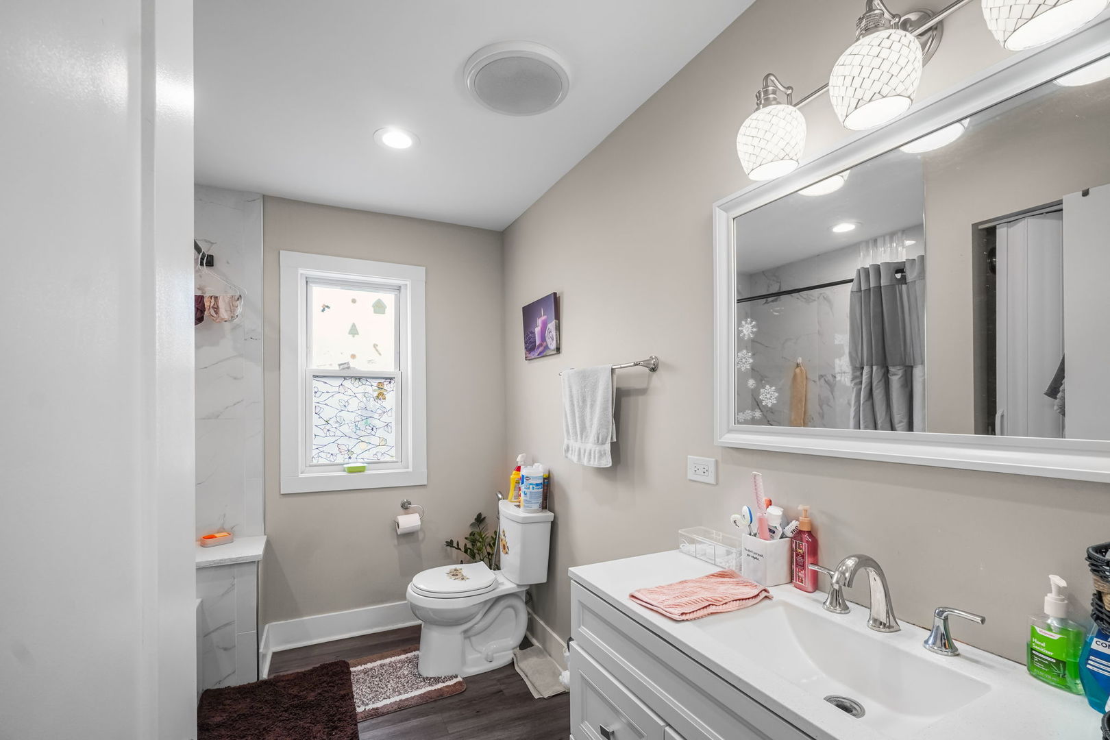 1906 South 60th Court Cicero, IL 60804 - Photo 30 of 40 a bathroom with a toilet sink and mirror