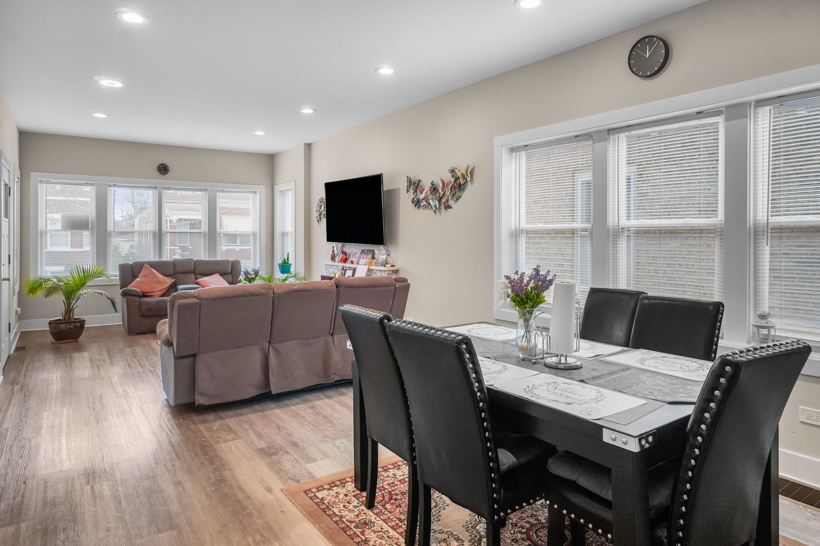 1906 South 60th Court Cicero, IL 60804 - Photo 9 of 40 a living room with furniture a large window and a flat screen tv