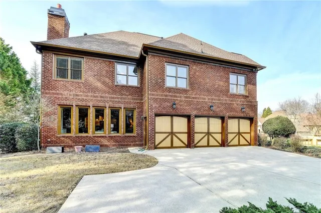 a kitchen with white cabinets and a stove top oven