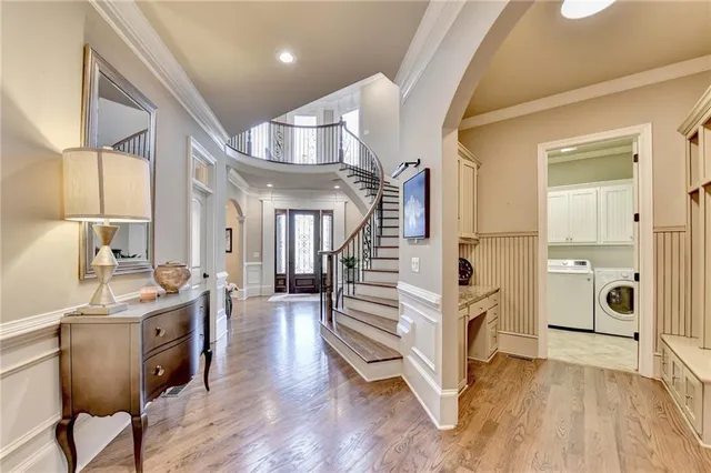 a living room with furniture and a ceiling fan