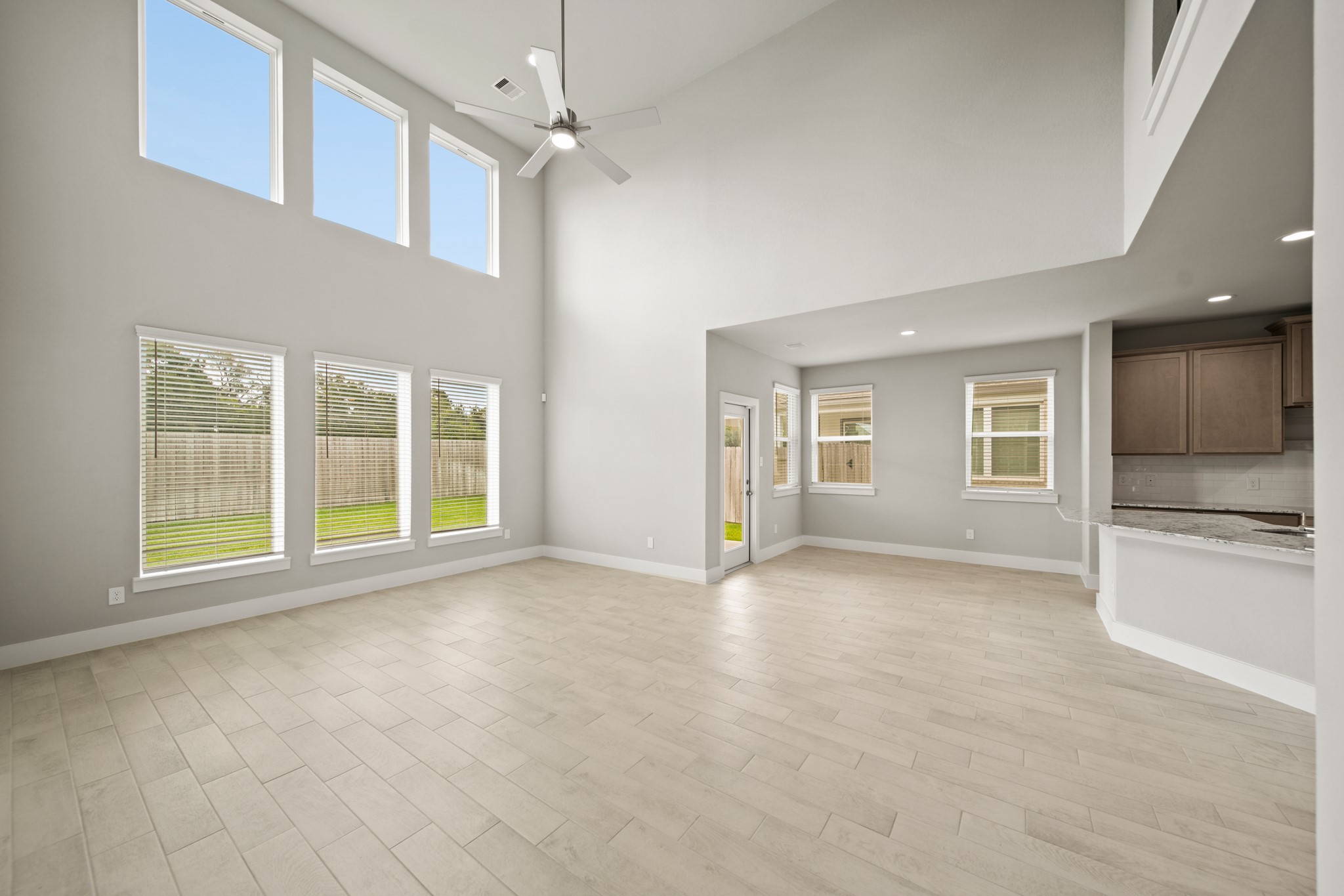 18227 Windy Knl Way Houston, TX 77084 - Photo 7 of 37 a view of an empty room with a kitchen