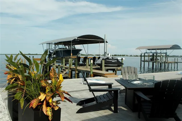 a view of a chairs and table in patio
