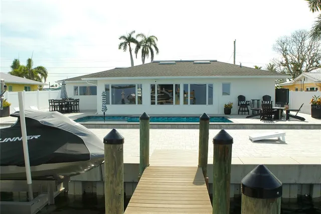 a front view of a house with swimming pool