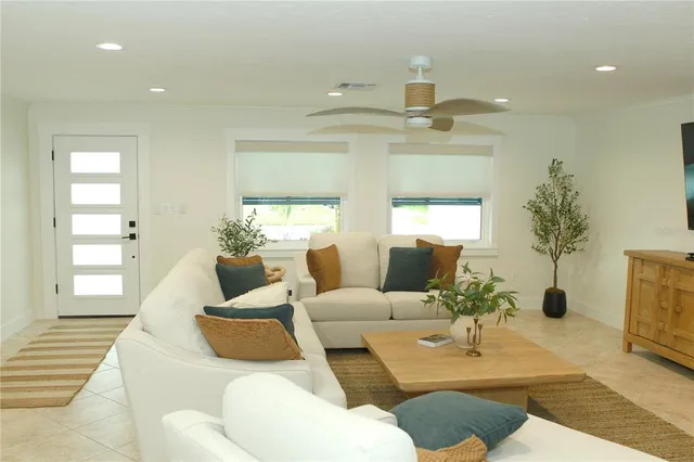 a living room with furniture and a window