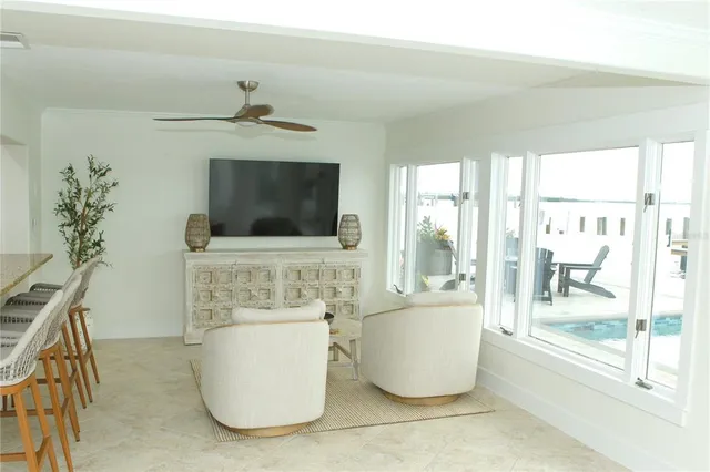 a living room with a flat screen tv and a fireplace